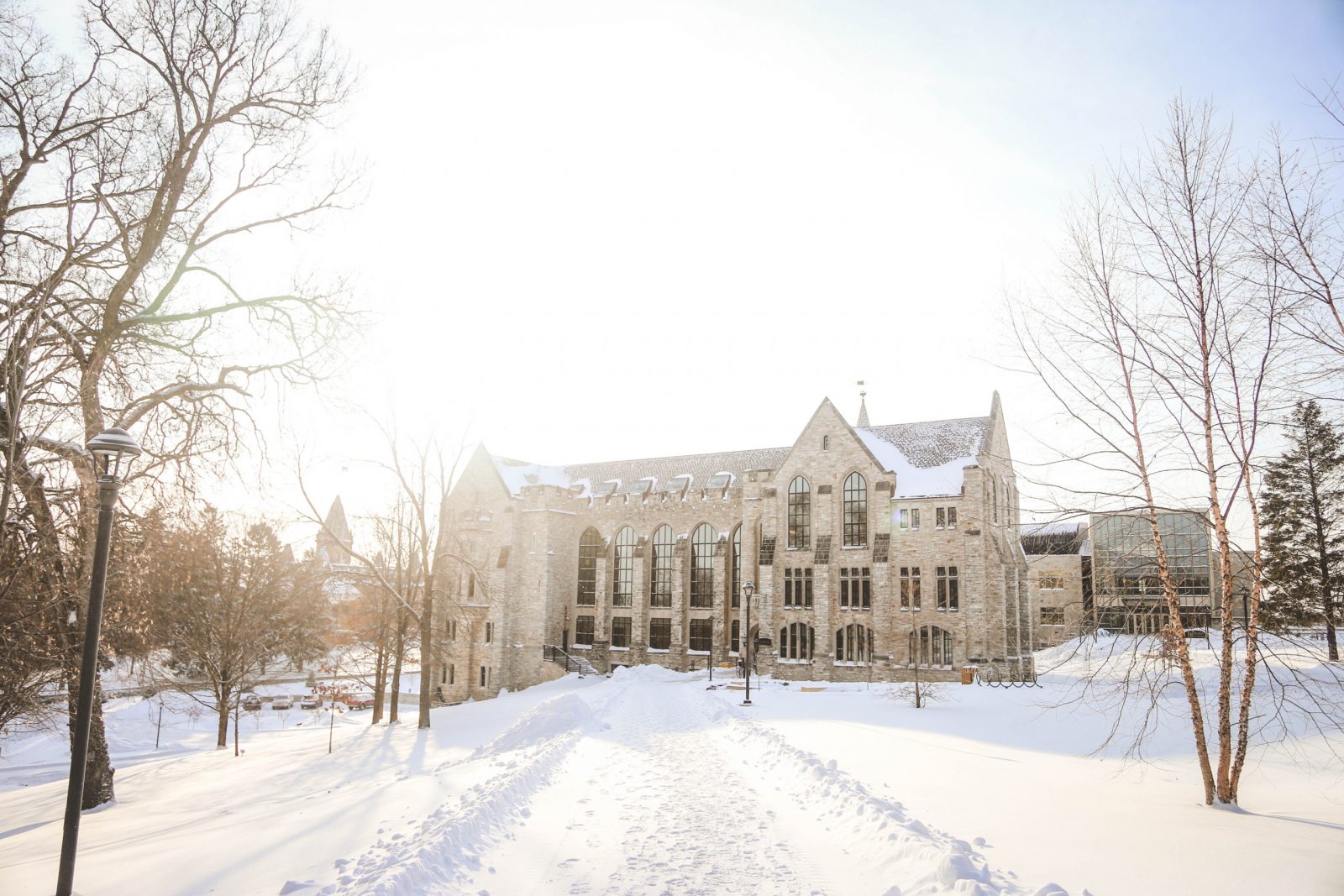 Holland Hall at St. Olaf College surrounded by snow on a bright winter day.