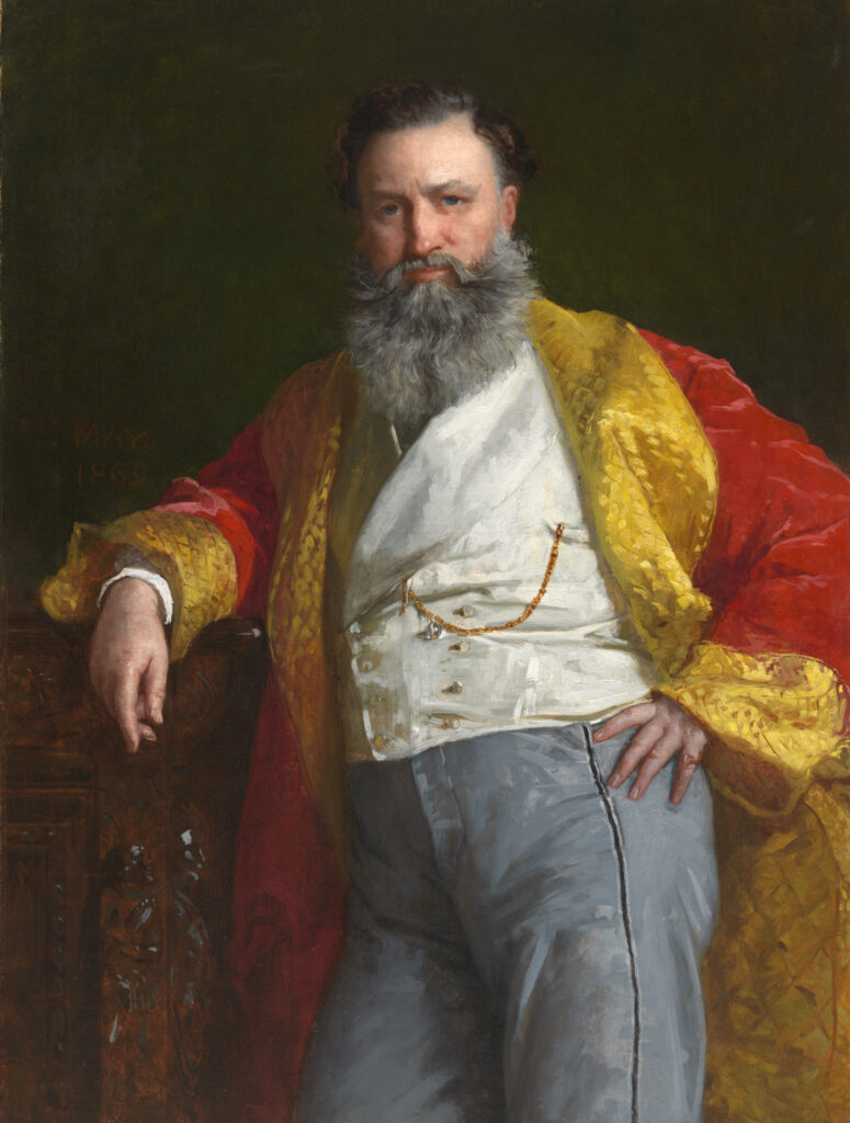 Portrait of Isaac Merritt Singer wearing dark formal clothing and a fur-trimmed coat.